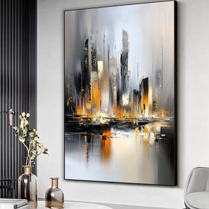 May include: Abstract painting of a city skyline with tall buildings in shades of gray, black, and orange. The buildings are reflected in a body of water at the bottom of the painting.