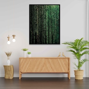 Könnte beinhalten: Ein gerahmter Druck eines digitalen Kunstwerks mit schwarzem Hintergrund und grünen und goldenen vertikalen Linien. Der Druck hängt an einer weißen Wand über einem Holzschränk.