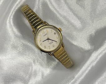 Elegancki damski zegarek Timex w kolorze złotym w kształcie koła