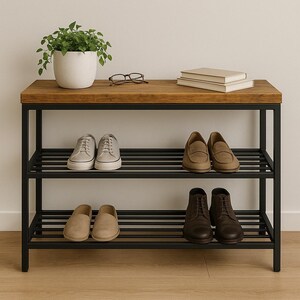 May include: A shoe rack with a wooden top and black metal frame, featuring three tiers. The top shelf displays a potted plant, glasses, and books. Various shoes are arranged on the lower shelves, including trainers, loafers, and boots.