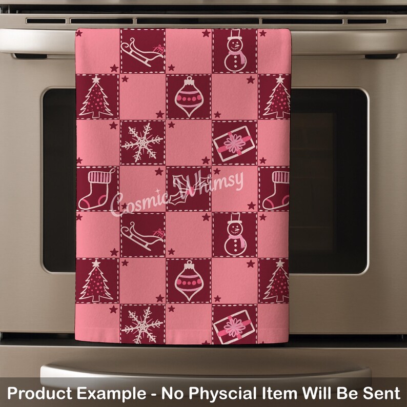 May include: A rectangular kitchen towel featuring a checkered pattern of alternating light pink and dark maroon squares. The fabric displays white line-art icons of Christmas trees, snowmen, snowflakes, gift boxes, stockings, and sleighs.