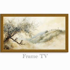 May include: A framed landscape painting featuring two small birds perched on a branch beneath a tree with white leaves. The artwork depicts a serene hillside with a cross on top, all within a gold-colored frame. The text "Frame TV" is at the bottom.