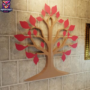 Può includere: Un'opera d'arte murale 3D raffigurante un albero stilizzato con foglie rosse e un tronco marrone. L'opera è montata su una parete strutturata di colore chiaro. Il logo Papercraft Dream è visibile in alto a sinistra.