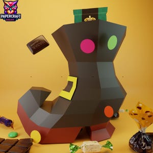 May include: A brown papercraft boot filled with various sweets and chocolates. The boot has pink, green, orange, and yellow accents. Several wrapped sweets and a chocolate bar are scattered around the boot.