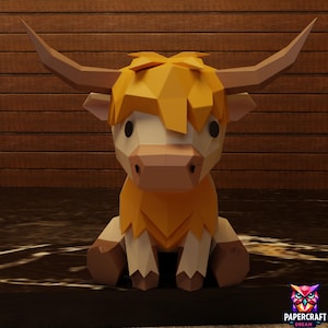May include: A papercraft Highland cow figurine with a geometric design. The cow has a tan body, brown legs, and a shaggy, orange-yellow mane. It features large, curved horns and is sitting down. The Papercraft Dream logo is in the bottom right corner.