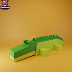 May include: A green and yellow papercraft alligator with a saw-tooth spine and cube-shaped legs. The alligator has black circular eyes and a rectangular snout. The logo "PAPERCRAFT DREAM" is in the upper left corner.