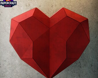 May include: A large, geometric red heart sculpture with a faceted design. The heart is made of paper and has a textured surface. The Papercraft Dream logo is in the upper left corner.