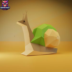 May include: A geometric papercraft snail sculpture with a green shell and tan body. The snail's body is a light tan colour, and the shell is a vibrant green and tan. The sculpture is set against a warm, yellow background. The logo "PAPERCRAFT DREAM" is in the upper left corner.