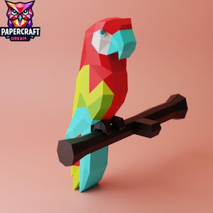 Può includere: Un pappagallo di carta rosso, giallo e blu appollaiato su un ramo nero. Il pappagallo è fatto di carta piegata e ha un effetto 3D.