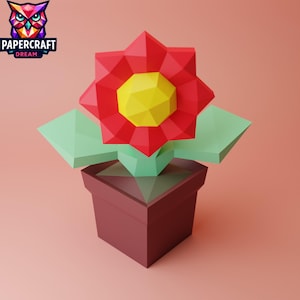 May include: A red paper flower with a yellow center in a brown pot. The flower and pot are made of paper and have a geometric design.