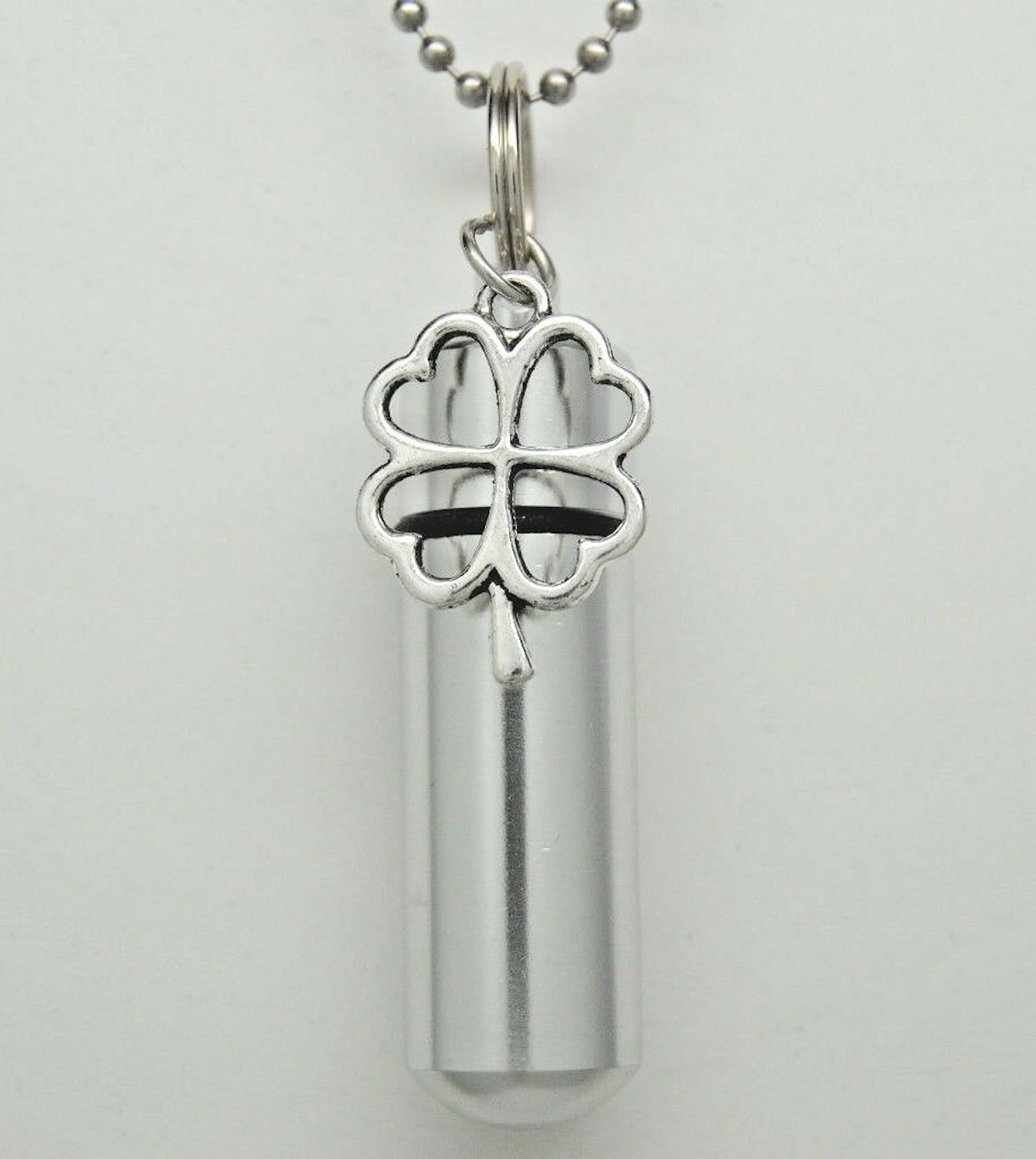 JMQJewelry Urn Necklace For Ashes - Leaf Clover Flower Cremation Keepsake Pendant With Funnel, Stainless Steel