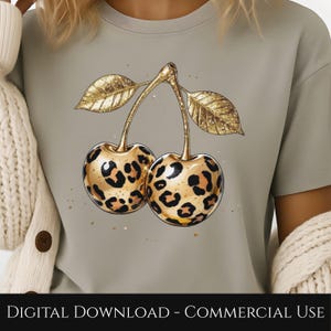 May include: A light gray t-shirt featuring a pair of cherries with a leopard print design. The cherries have gold stems and leaves. The text "DIGITAL DOWNLOAD - COMMERCIAL USE" is at the bottom of the image.