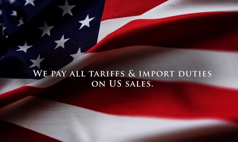 a close-up view of the American flag, with the text "We pay all tariffs & Import duties on US sales." superimposed on the image.