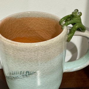 Frog sitting on mug (handmade ceramics pottery)