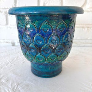 May include: A rustic wooden sign with the text "Welcome to our home" in white lettering. The sign features a distressed finish and a simple, inviting design, perfect for entryway decor.