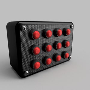 May include: A black box with a carbon fibre texture and ten red push buttons.