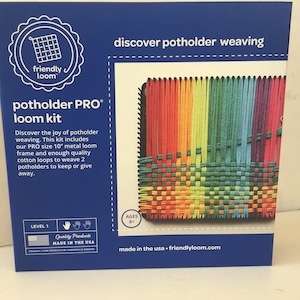 May include: A blue box with a rainbow potholder weaving kit. The box says "discover potholder weaving" and "potholder PRO loom kit". The kit includes a 10-inch metal loom frame and enough cotton loops to weave two potholders. It is made in the USA and is for ages 8 and up.