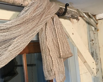 Natural dyed woven swag curtain and brackets over a birch branch rod  natural organic woods window treatments off white