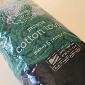 May include: A package of Friendly Loom pro size cotton loops in shades of green, gray, and black. The package states it makes 6 potholders and is made in the USA. Ages 8+.
