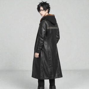 May include: A long black leather coat with a hooded sweatshirt underneath. The coat has a button closure and a grey stripe across the upper back. The hood has an orange trim. The person is wearing black trousers and boots.