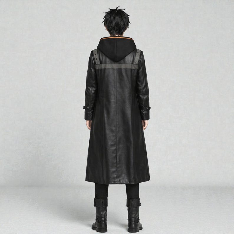 May include: A long black leather coat with a hood, featuring a grey stripe across the shoulders and orange trim on the hood. The coat has a button closure and is worn with black trousers and boots. The person is viewed from the back.