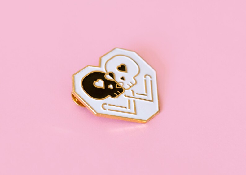 DISOUNTED: Kissing Skulls Gold enamel pin image 1