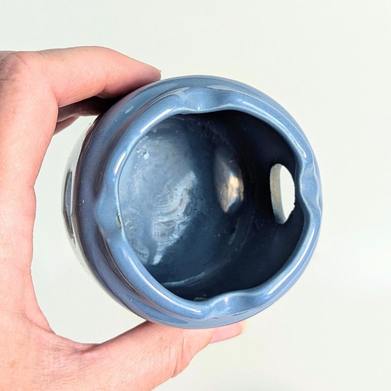 Inside the base of the vintage tealight holder is clean