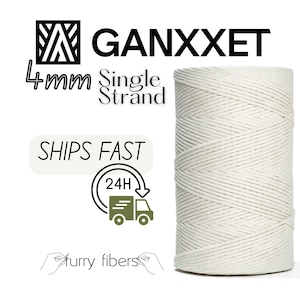 May include: A cylindrical spool of off-white, single-strand cotton cord. The text "GANXXET" is at the top, with "4mm Single Strand" below. Additional text reads "SHIPS FAST" with a 24-hour delivery truck icon, and "furry fibers" at the bottom.