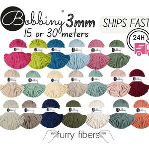 May include: A collection of colorful Bobbiny 3mm macrame cord spools. The image displays various shades, including pink, green, blue, and beige. Text on the image reads "Bobbiny 3mm 15 or 30 meters" and "Ships Fast".
