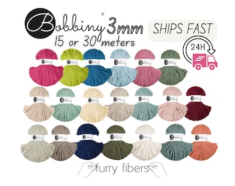 May include: A collection of colorful Bobbiny 3mm macrame cord spools. The image displays various shades, including pink, green, blue, and beige. Text on the image reads "Bobbiny 3mm 15 or 30 meters" and "Ships Fast".
