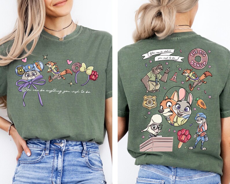 a woman wearing a green t-shirt with a cartoon character design on the front and the back.