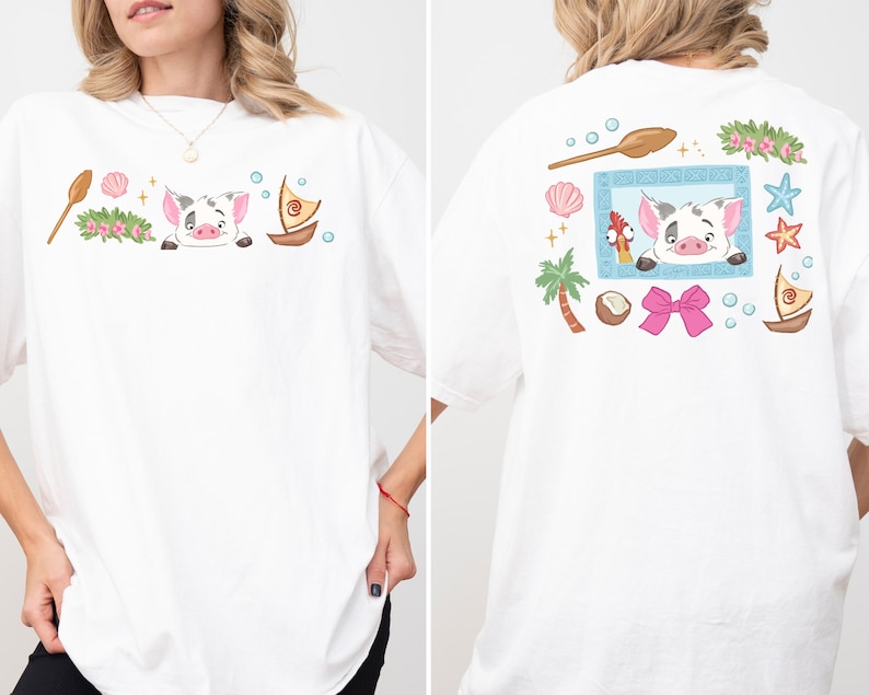 A woman wearing a white t-shirt with a colorful graphic design featuring a pig, palm tree, seashells, starfish, and other beach-themed elements.