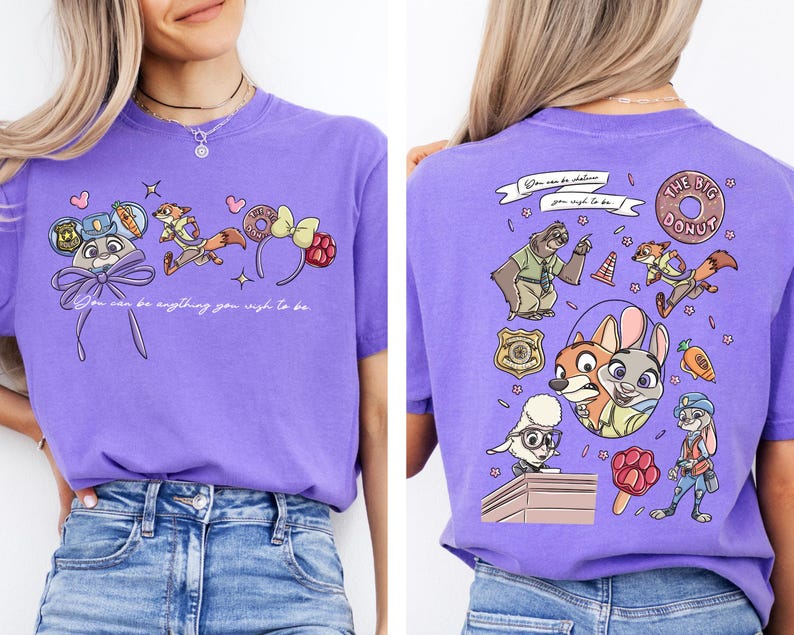 a woman wearing a purple t-shirt with a cartoon character design on the front and back.