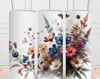 May include: Three white stainless steel tumblers with a floral design. The flowers are in shades of pink, blue, and purple. The design is centered on the tumbler and extends to the top and bottom.