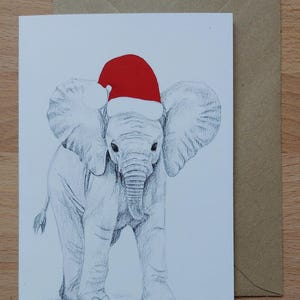 Tarjeta navideña de elefante // Tarjeta de felicitación festiva con cría de elefante y un solo gorro de Papá Noel