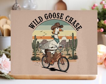 Wild Goose Chase Glass Chopping Board. Goose Gifts for Her. Quirky 'Goose on a bike' Kitchen Decor. Gifts for Cooks. Glass Worktop Savers.
