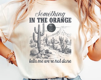 Something In The Orange Tee, Country Song Inspired Sunset Desert Graphic Shirt, Western Music Lyric T-Shirt
