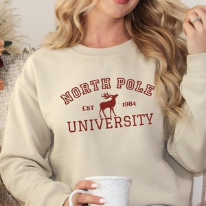 North Pole University Sweatshirt, North Pole Sweatshirt, Christmas Collage Sweatshirt, Christmas Gifts, Winter Sweatshirt, Holiday Gift