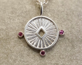 Aurora sterling silver and rhodolite necklace, garnet necklace, celestial necklace, talisman, medallion, sun necklace, January birthstone