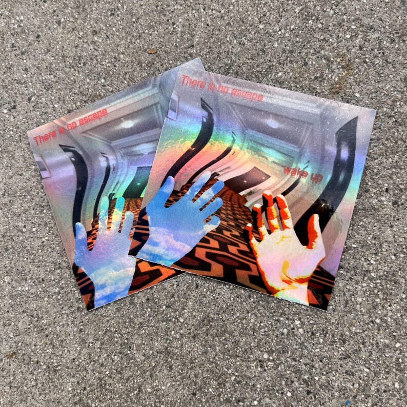May include: Two square holographic stickers featuring a surreal hallway with a geometric orange and black carpet pattern. Each sticker displays a hand in the foreground, the text "There is no escape" at the top, and "Wake up" on the right side.