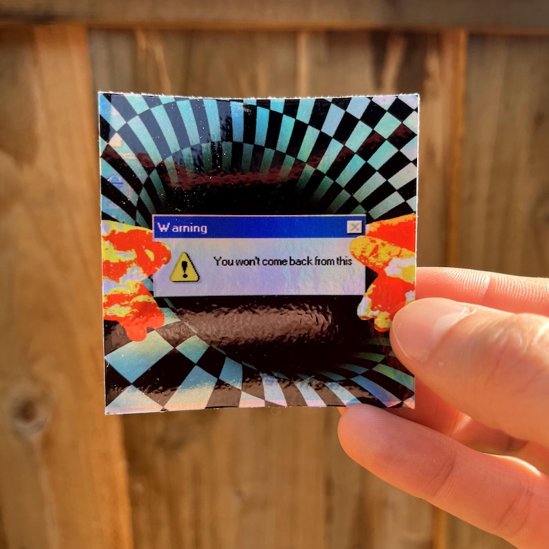 May include: A square holographic sticker featuring a black and teal checkered vortex pattern. Centred is a blue computer-style warning box with a yellow triangle icon and the text: Warning. You won't come back from this. Orange flames flank the sides.