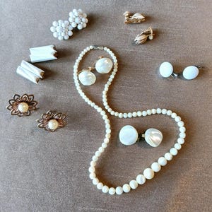 Seven Vintage White Earring Sets and a Mother-of-Pearl Necklace