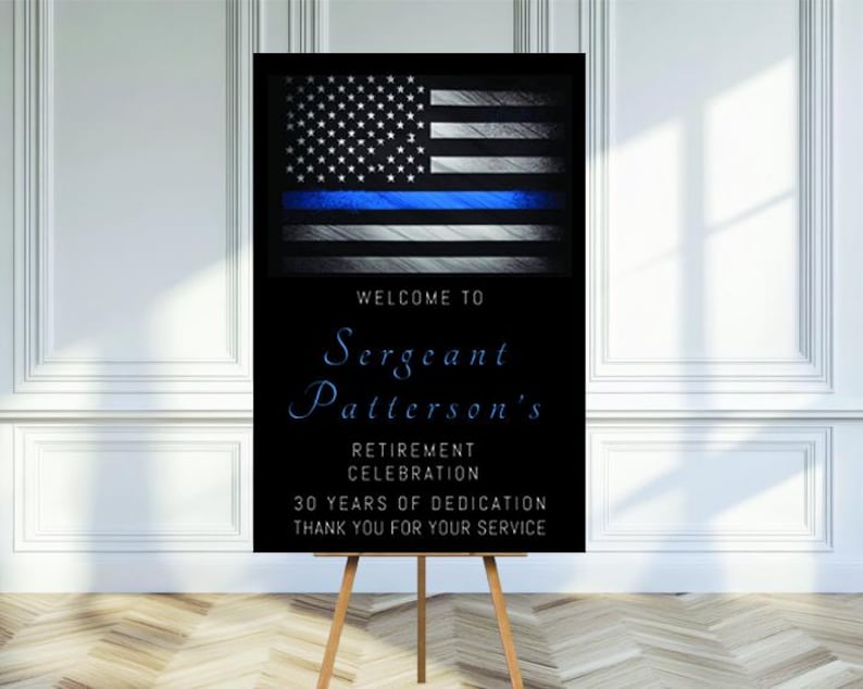 May include: A black and white welcome sign with a thin blue line American flag. The sign reads "Welcome to Sergeant Patterson's Retirement Celebration 30 Years of Dedication Thank You for Your Service".