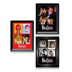 May include: Three framed Beatles art prints. One print features a vibrant pop art style image of the band members. The other two prints are black and white photographs of the band members. The Beatles logo is at the bottom of each print.