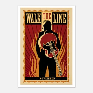 Op de afbeelding: Een rechthoekige poster met het silhouet van een persoon in een pak die een akoestische gitaar vasthoudt. De achtergrond toont rode zonnestralen en oranje vlammen. De tekst luidt WALK THE LINE bovenaan en NOVEMBER onderaan in schreeflettertype.