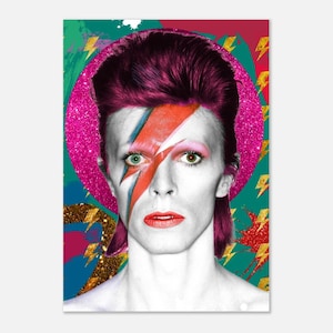 May include: A colorful portrait of David Bowie with a lightning bolt painted across his face. The background is a vibrant mix of pink, green, and gold.