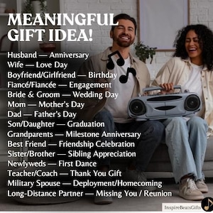 May include: A white ceramic mug with a black handle and the text "But First, Coffee" in a bold, black font. The mug is set against a blurred background. The mug is approximately 10 cm tall.