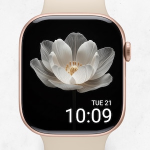 May include: A rose gold smartwatch with a black screen displaying a white flower graphic. The screen shows the date and time: Tue 21, 10:09. The watch has a cream-colored band.