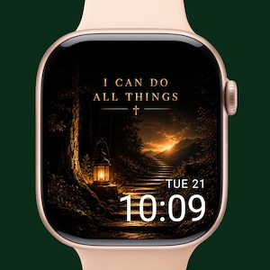 Op de afbeelding: Roségouden smartwatch met een zwart scherm met de tekst "I CAN DO ALL THINGS" boven een kruis. Het scherm toont een pad dat naar een zonsondergang leidt, met een lantaarn en de tijd 10:09.
