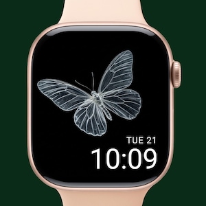 May include: A rose gold smartwatch with a black screen displaying a detailed, transparent butterfly graphic. The time is 10:09 on Tuesday, the 21st. The watch has a light pink band and a dark green background.